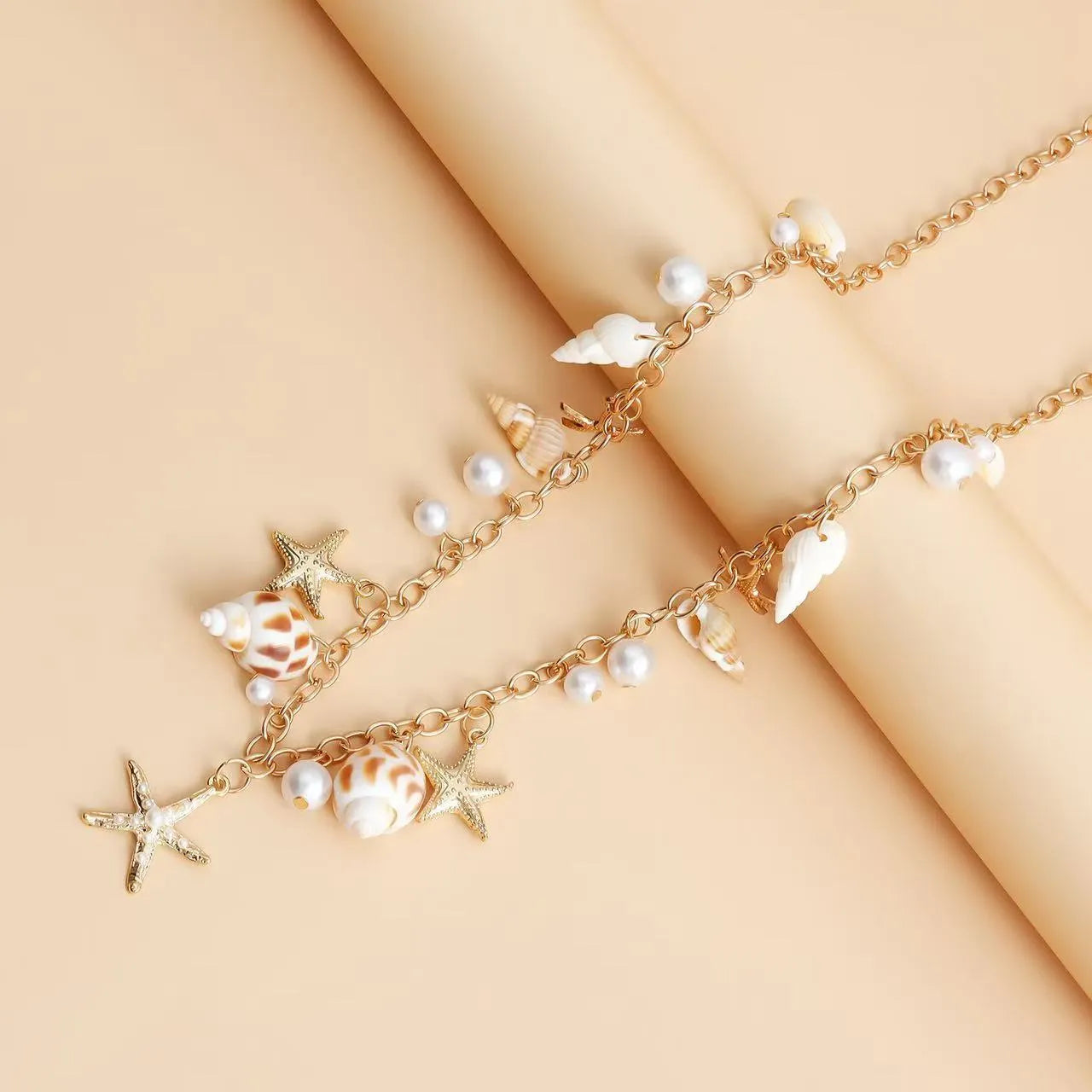 Women's waist chain and bracelet set with star detailing in alloy metal