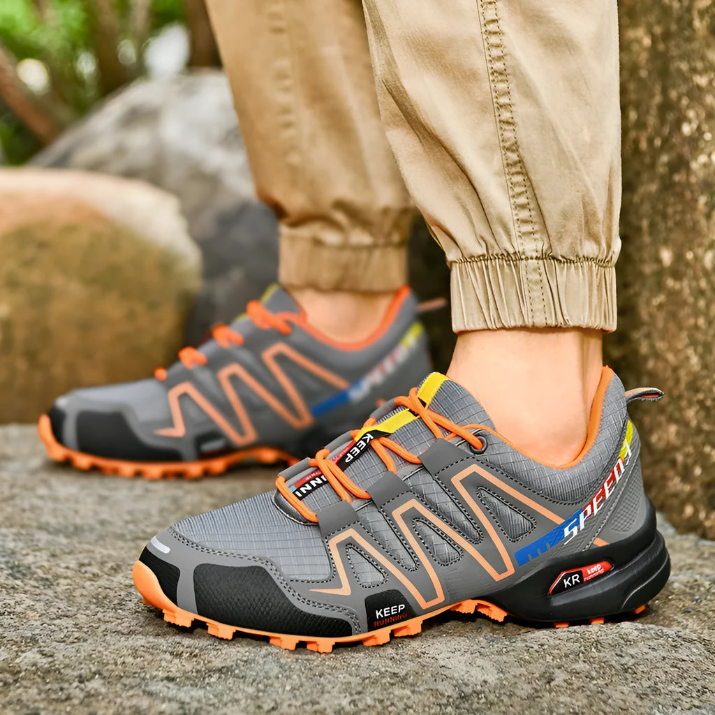Men's grey-orange plus size casual shoes with synthetic leather upper and rubber sole.