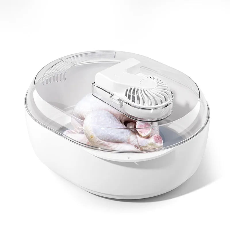 Aluminium household defrosting plate for food on a kitchen countertop.