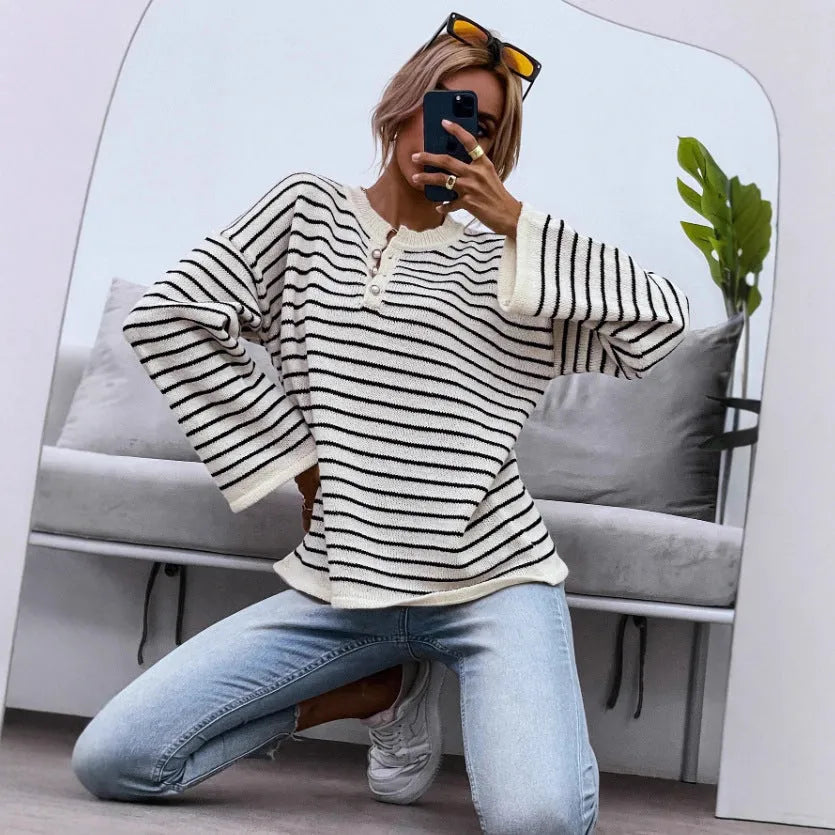 Black and white striped women's casual top with drop-shoulder sleeves and loose fit