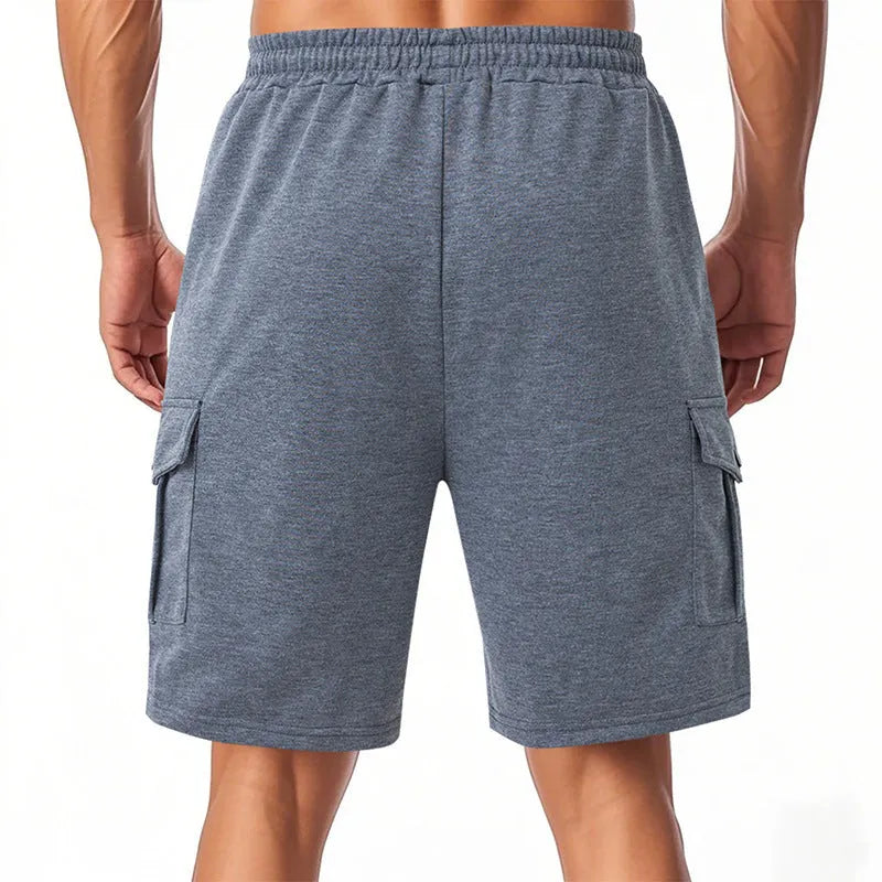 Men's loose fit cargo shorts with multiple pockets in terry fabric, shown in light grey colour