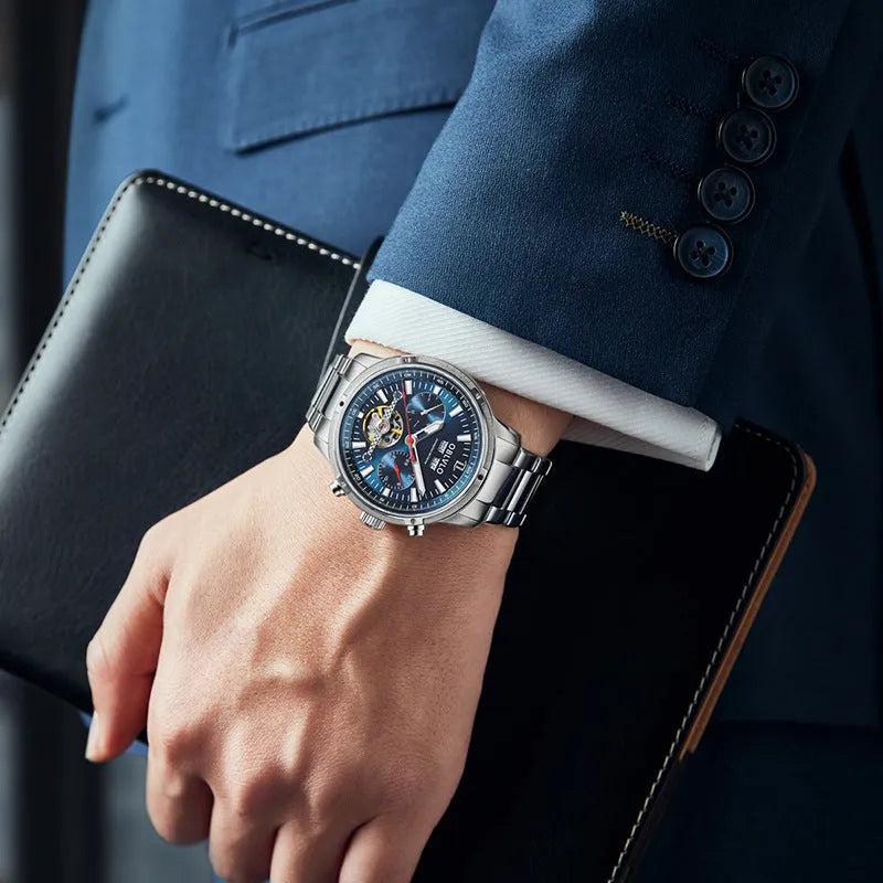 Men's multi-functional hollowed fashion watch with date display, steel strap, silver blue colour