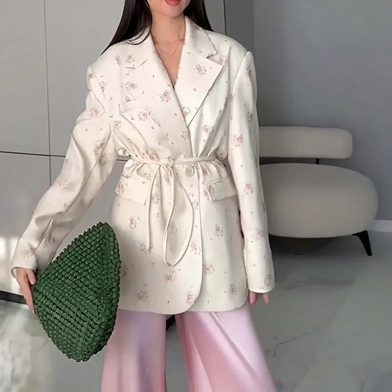 Women's floral print suit jacket with lace-up waist detail on collar, shown in apricot colour