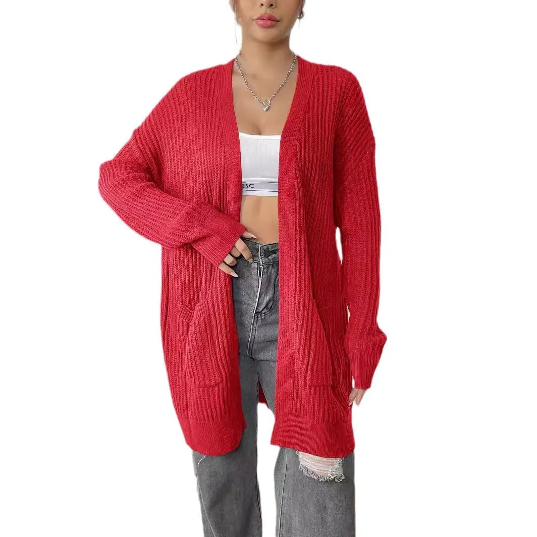 Women's dark green loose-fit acrylic cardigan with double pockets and long sleeves.