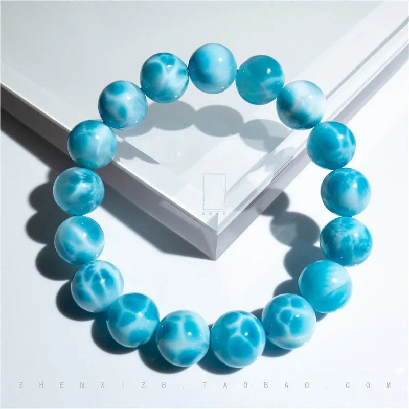 Blue handmade Bodhi bead bracelet with crystal sea-pattern stone and pearl accent on wrist