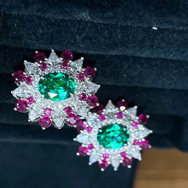 White gold stud earrings with oval zircon stone and geometric floral design on copper base