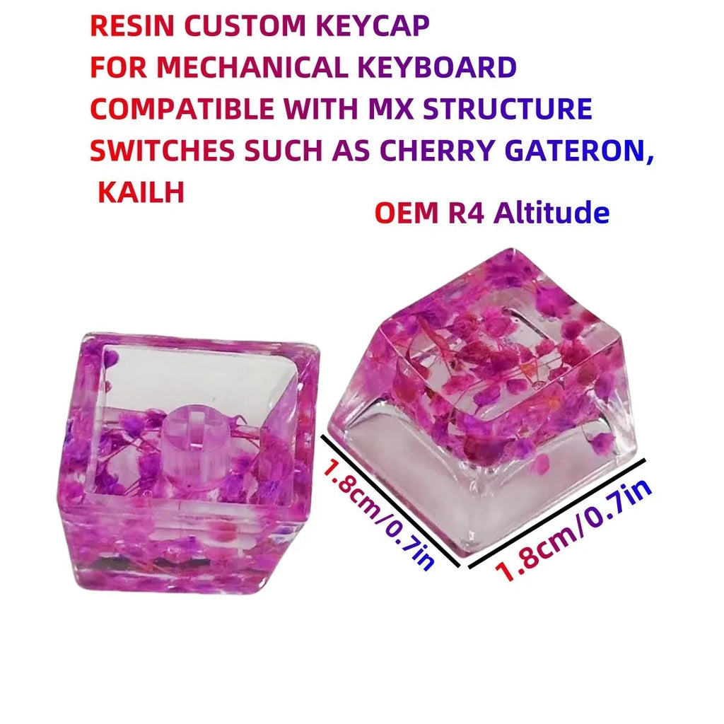 Transparent resin mechanical keyboard keycap with starry sky design in green, pink, red, violet colours.