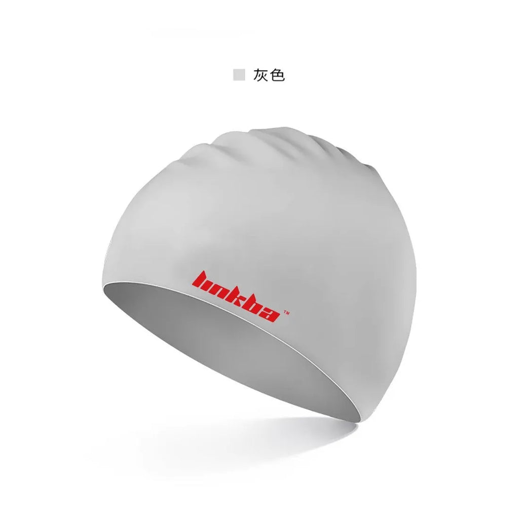 Silicone swimming cap with earmuff design for ear protection, shown in various colours