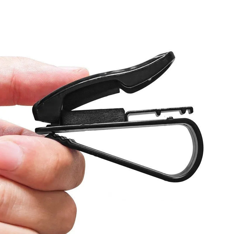 Black plastic car sunshade clip holder for glasses and tickets on a car visor