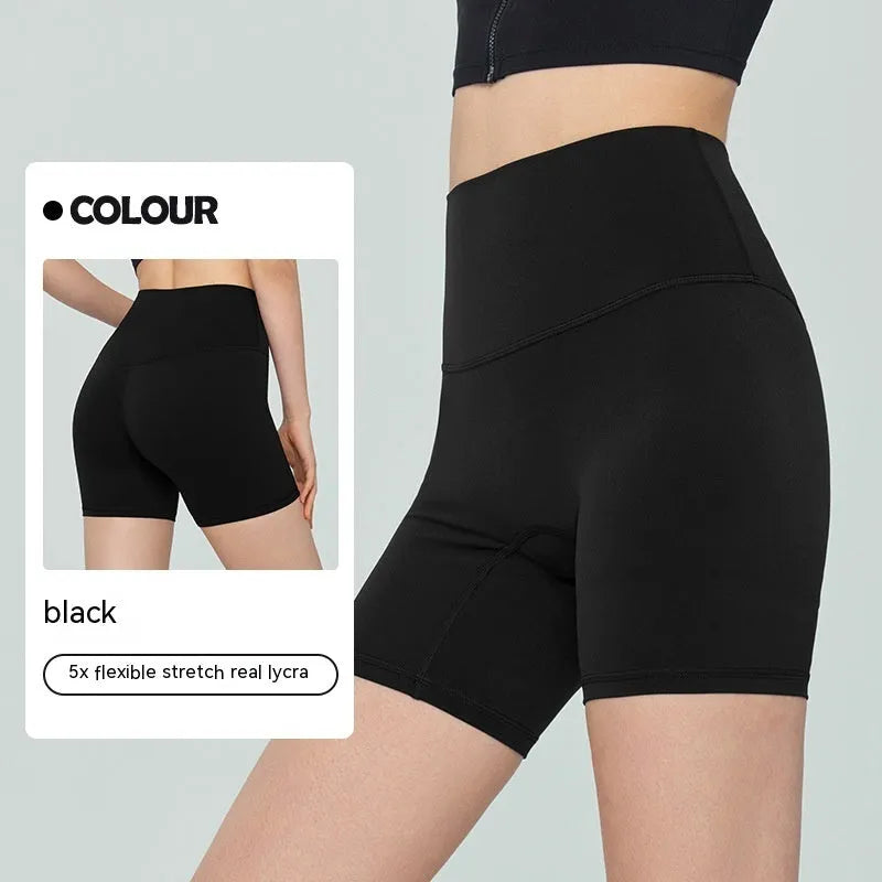 Woman wearing high-waisted leaf green Lycra yoga shorts with a four-point anti-exposure design.