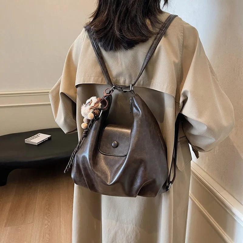 Textured PU leather shoulder bag in horizontal square shape with single strap and internal phone pocket