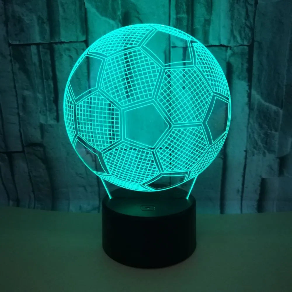 3D football-shaped acrylic night light glowing in blue with a black ABS base and remote control.