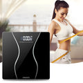 Black electronic bathroom scales with digital display showing weight measurement up to 180 kg capacity