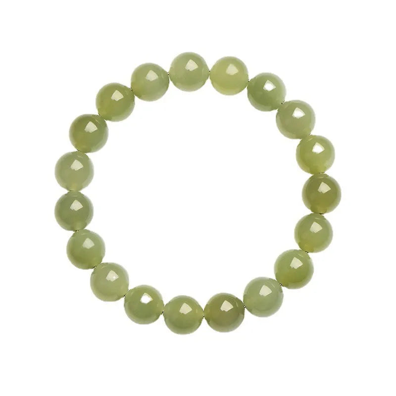 Polished Hetian Jade ball bracelet in clear water colour on a wrist, showing multiple bead sizes.