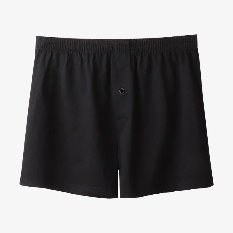 Men's black cotton loose boxer shorts with a high waist on a white background