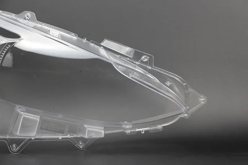 Mazda 3 Exela car headlamp cover replacement part with tube of snake glue adhesive.