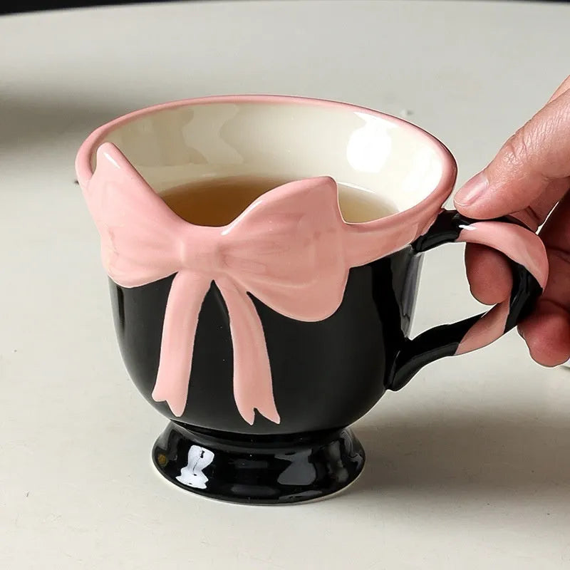Ceramic mug with girl heart bow design in black pink or white powder colour, 301-400ml capacity