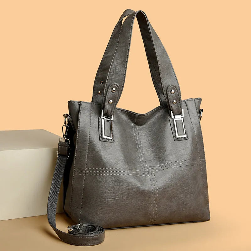 PU women's handbag in black with horizontal square shape and sewing thread details