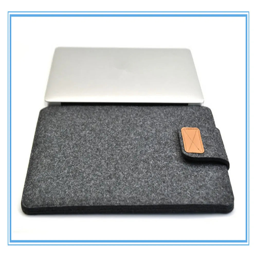 Dark grey felt plush clamshell laptop bag showing interior with corner protector and computer compartment