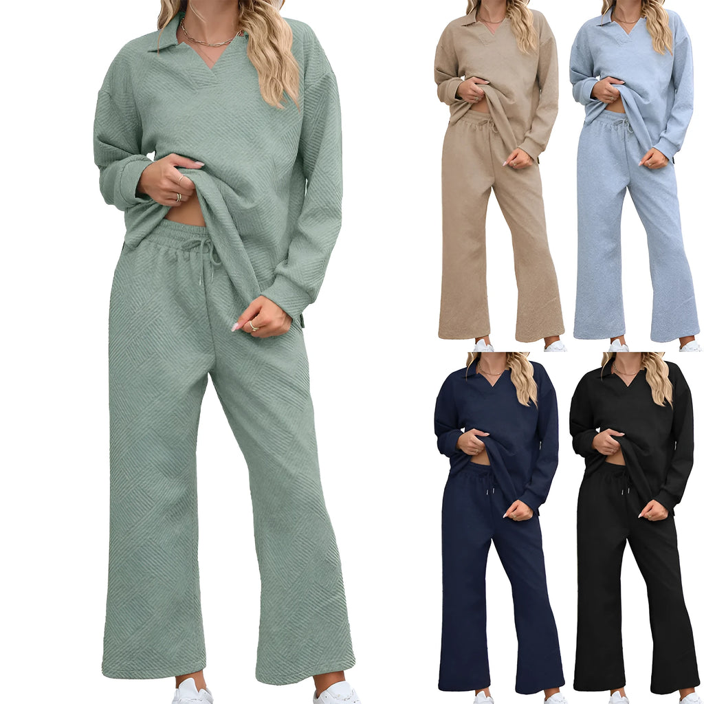 Women's black knitted jacquard two-piece suit with geometric pattern, showing long sleeve sweater and cropped elastic waist trousers.