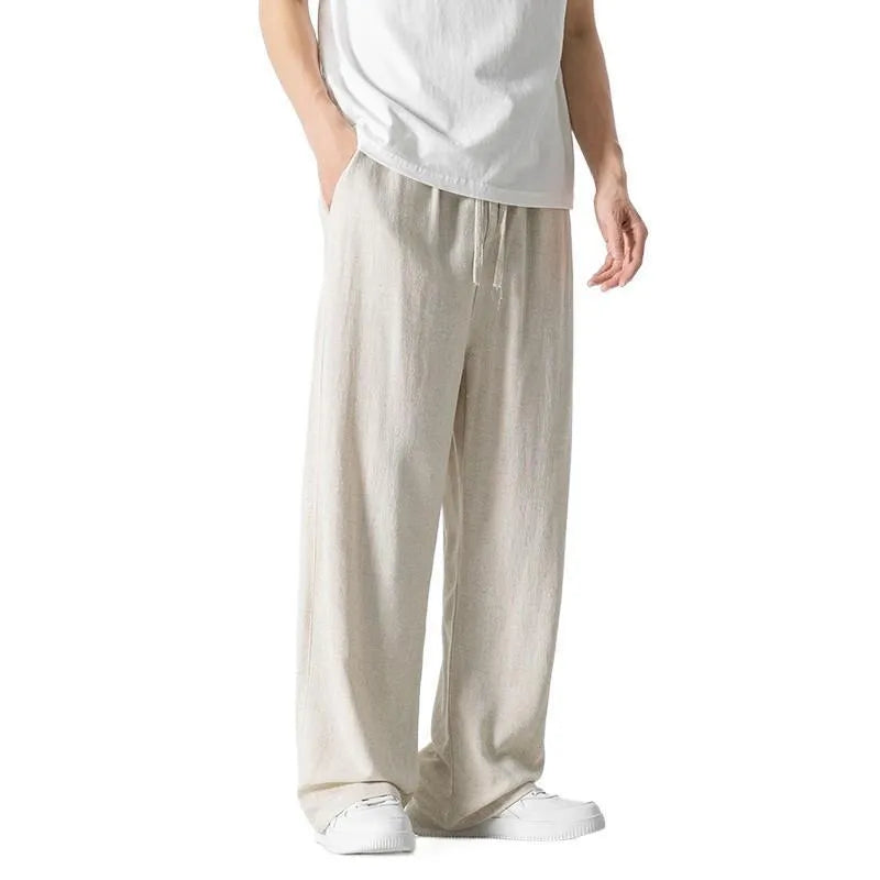 Men's beige bamboo fibre linen trousers with a straight leg, cropped length, and drawstring waist on a mid-rise.