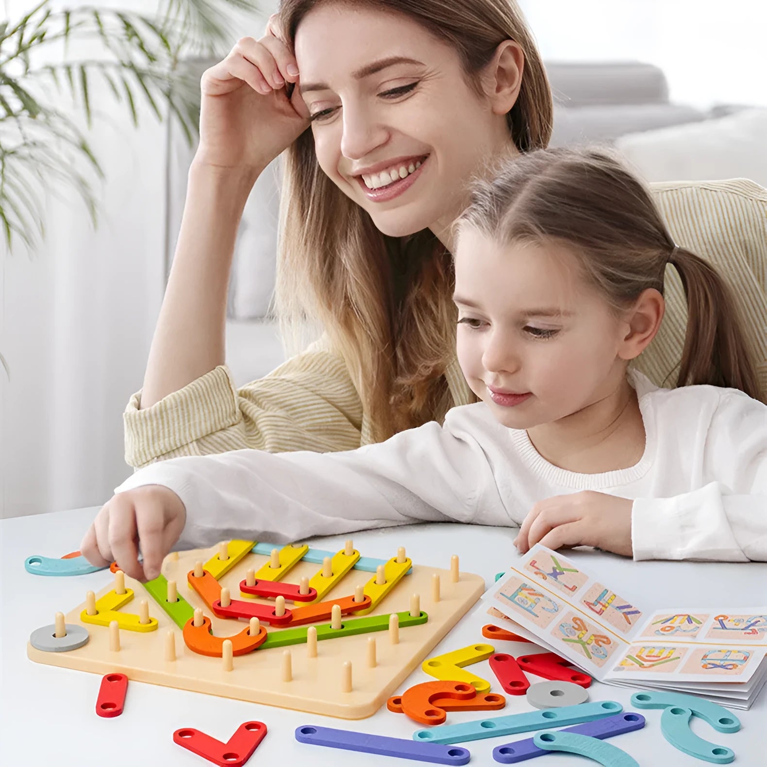 Wooden shape assembling column toy with 33 coloured shapes in a colour box, for children 4-6 years old