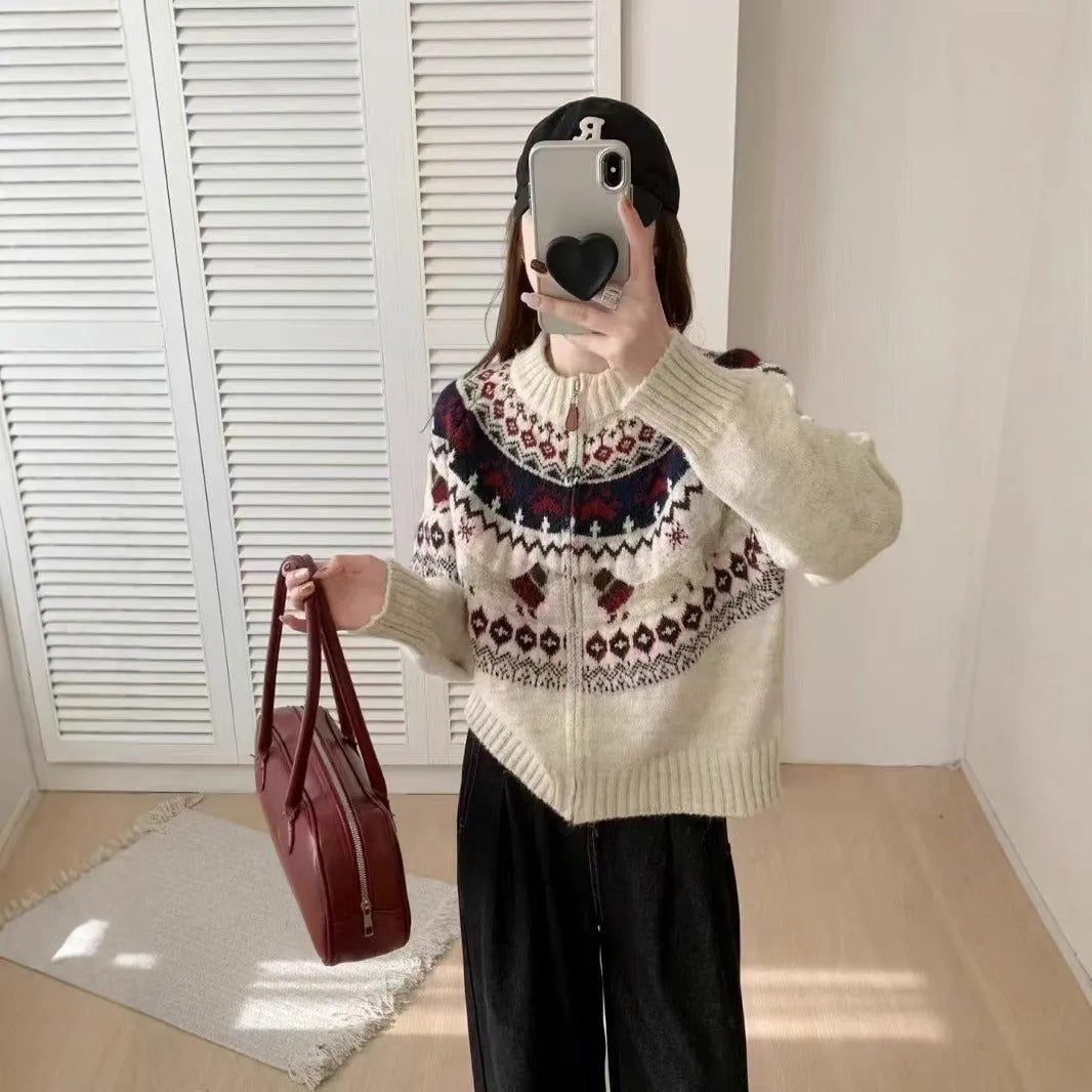 Ethnic style beige apricot jacquard pullover sweater with 3D pattern on a hanger.