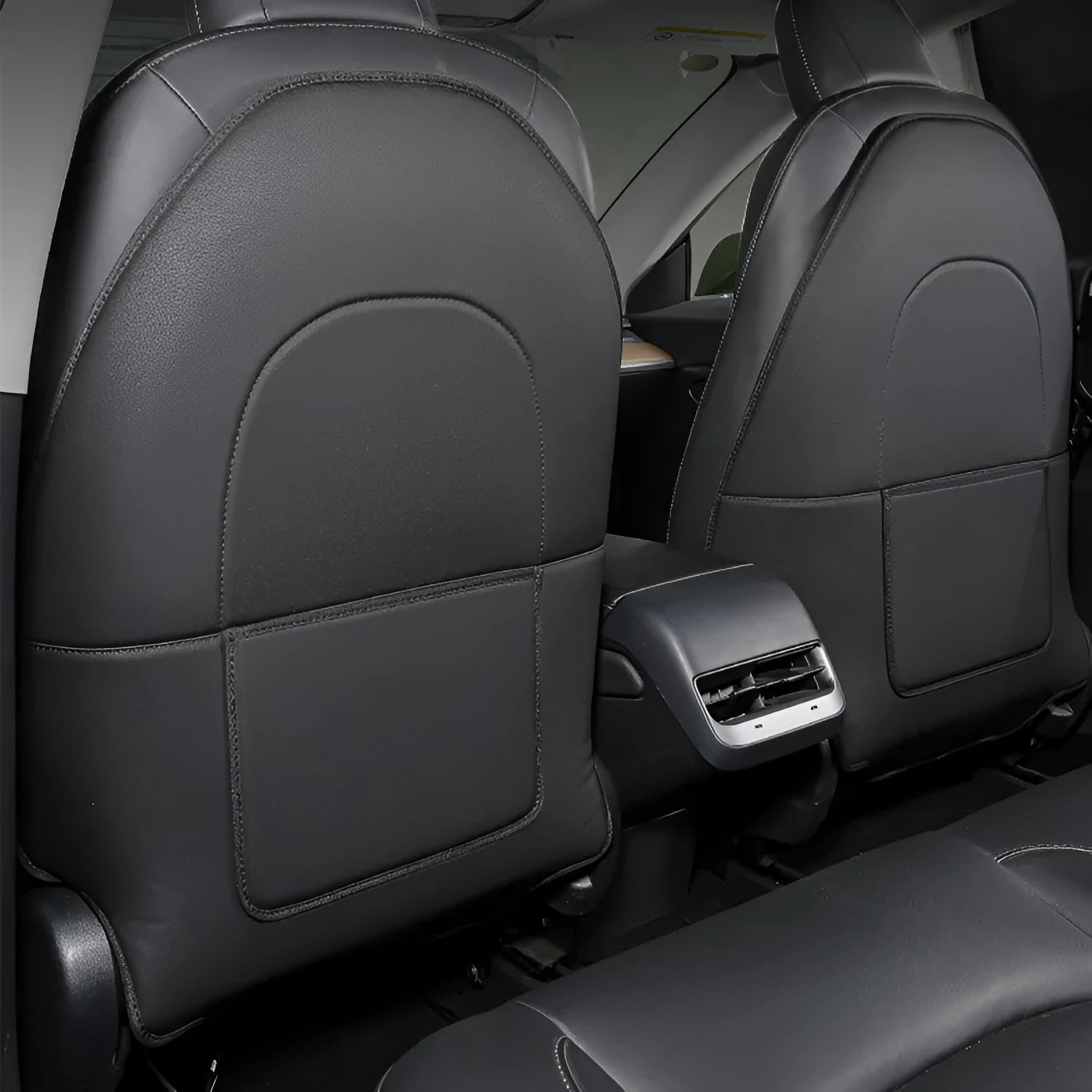 Black leather rear anti kick pad for car seat, shown with a single storage pocket.