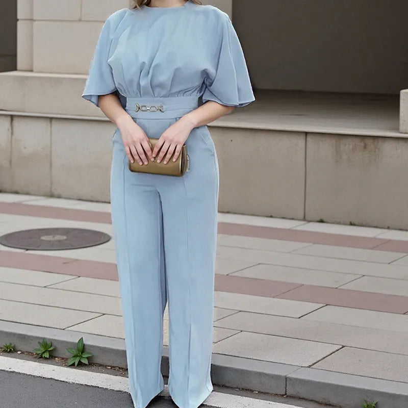 Blue polyester men's suit set with trousers and a long-sleeved top on a hanger