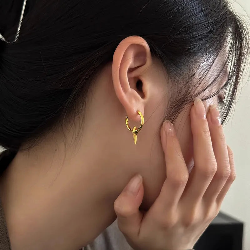 A pair of platinum-coloured geometric star-shaped clip-on earrings for women, made from electroplated copper.