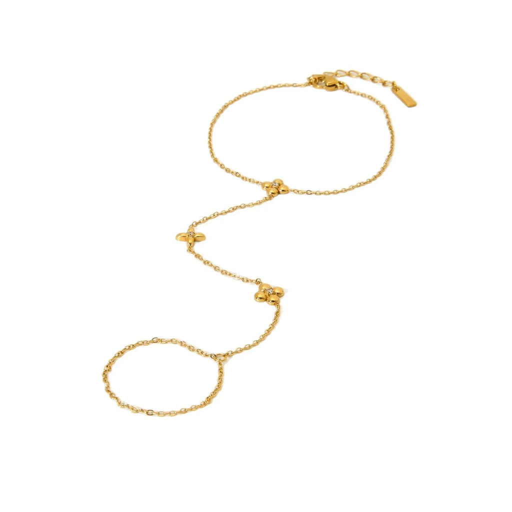 Gold-coloured stainless steel women's bracelet with eight-pointed star and floral charm design