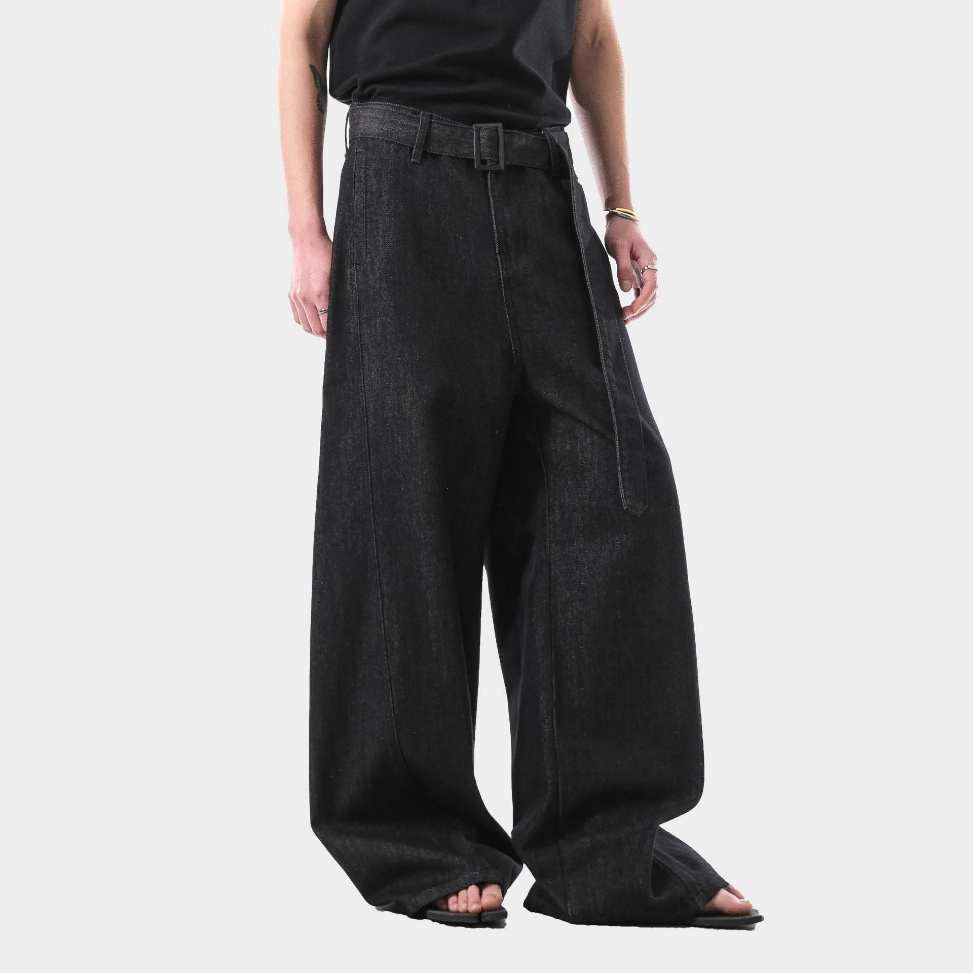 Black high waisted straight leg jeans with gold accents and zip fly opening