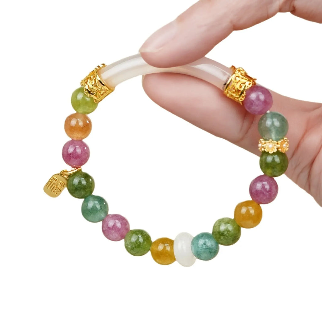 Natural rainbow coloured tourmaline gemstones on a women's jade pith half bracelet with electroplated finish.