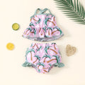 White children's swimsuit set consisting of top and shorts for beach and pool use