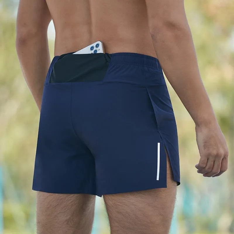 Men's black off-road running shorts with a loose fit and high waist, shown for running activity.