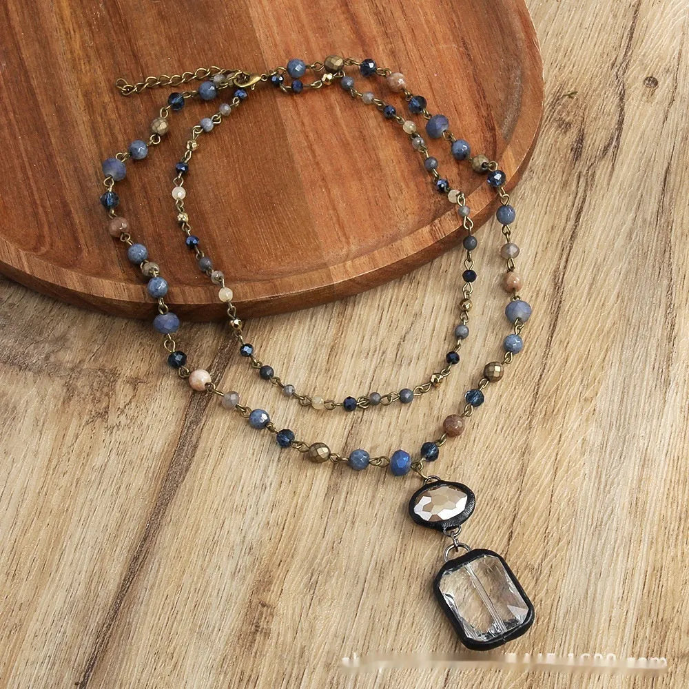 Tribal style two-layer chain necklace with stone and glass pendants in beige or blue colours