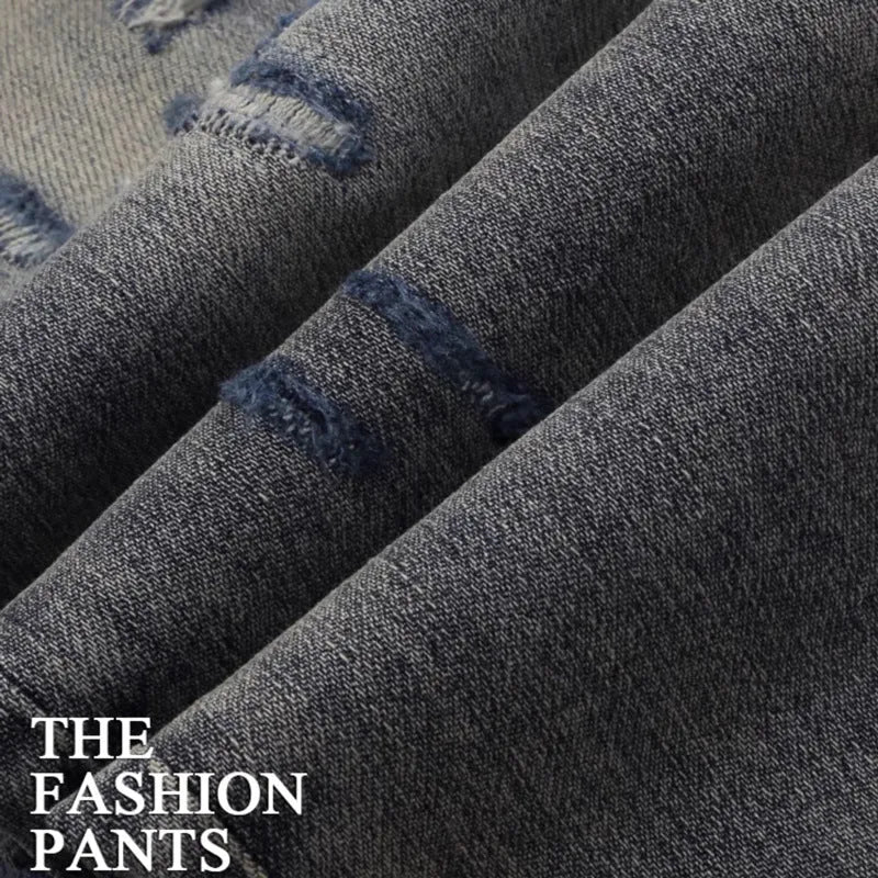 Old colour slim fit jeans with worn looking washed-out finish and trendy hole patch embroidery details