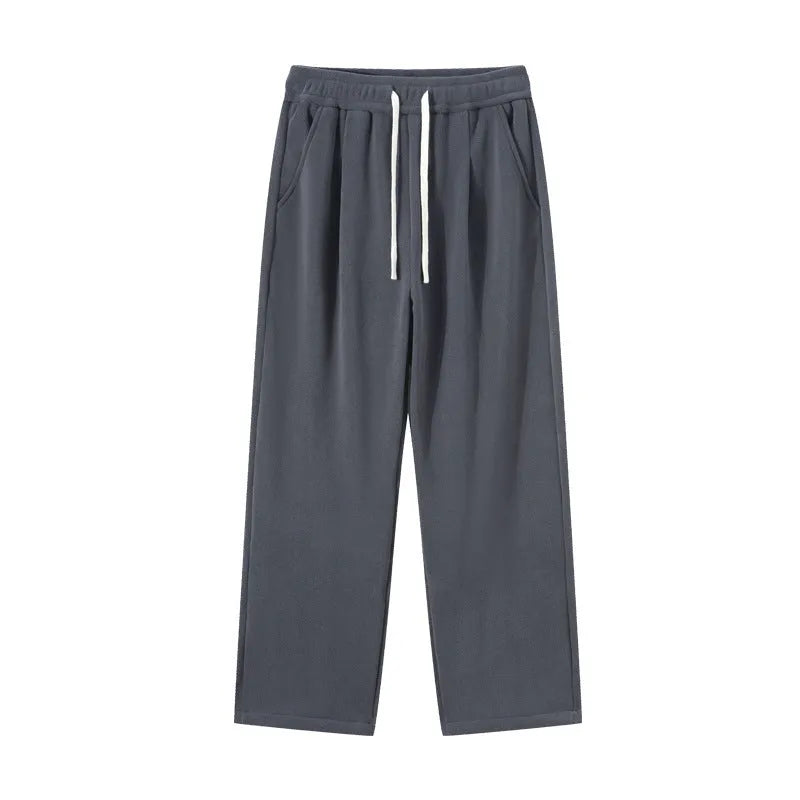 Men's apricot double-sided polar fleece-lined loose fit winter sports trousers on a hanger