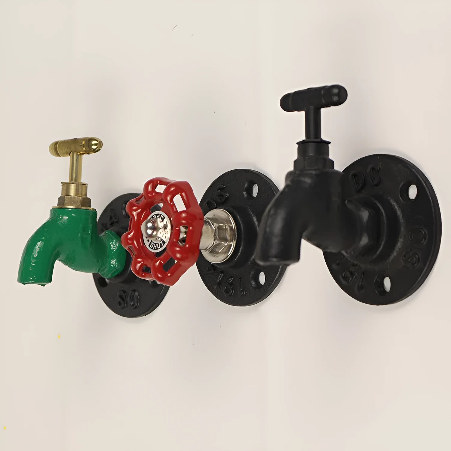 Modern water pipe style metal towel rack hook mounted on a wall in black finish.