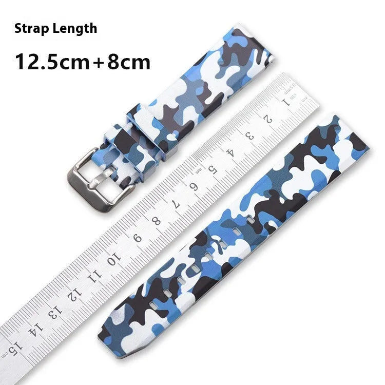 Green camouflage silicone watch strap with flat head, shown alongside blue and grey versions.