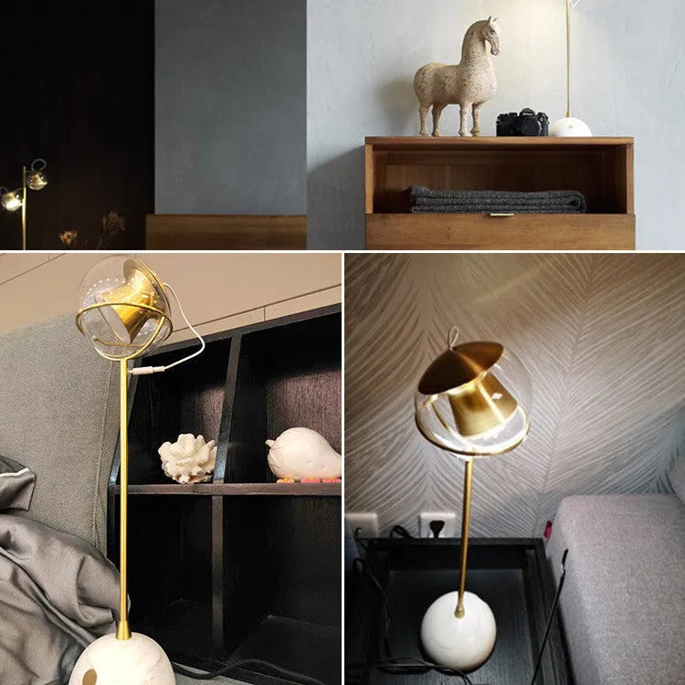 Glass desk lamp with dimmable touch switch and LED light source on desk surface