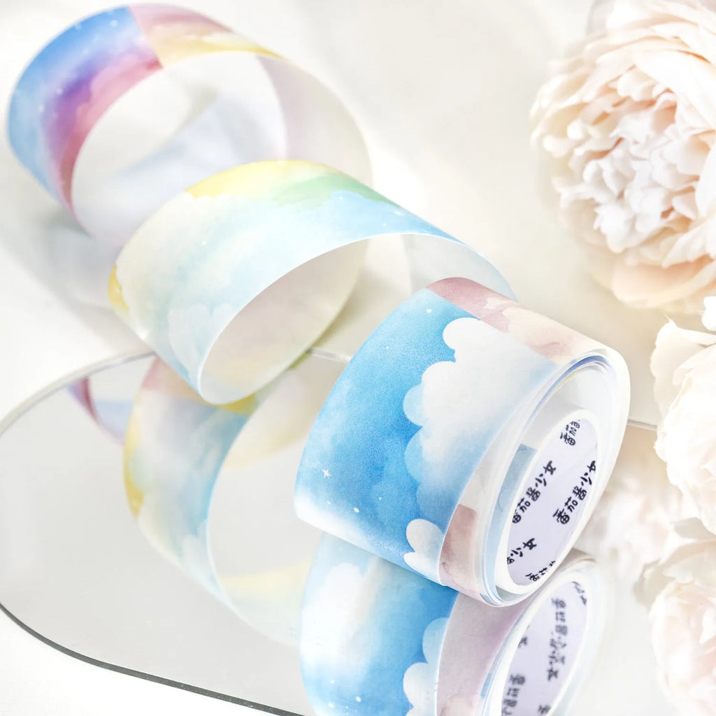 Japanese paper washi tape roll with cloud and sky theme designs including twilight and purple nebula patterns
