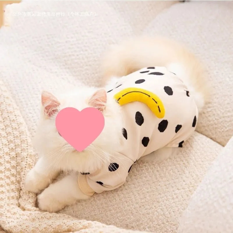 Anti-lint pet clothing in Dralon, white polka dot banana design, side view on a light background