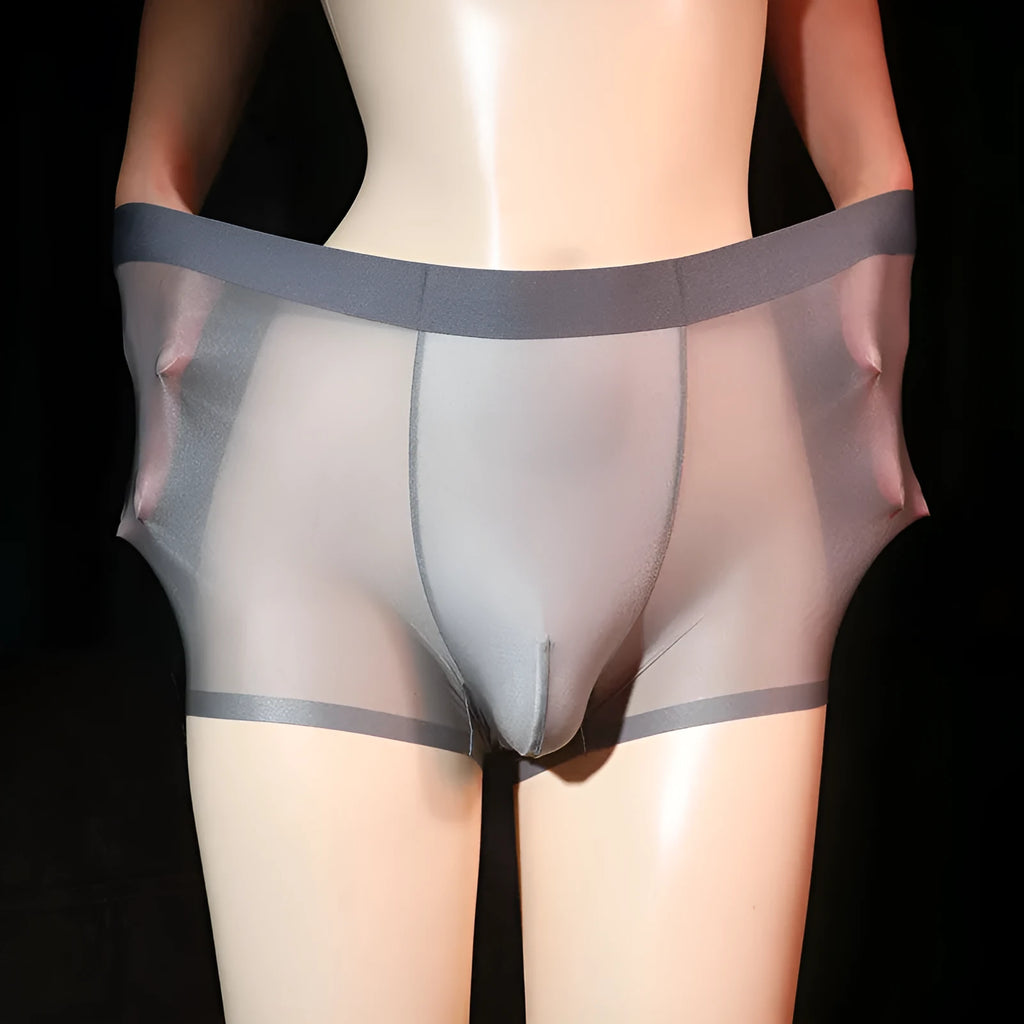Ultra-thin transparent men's ice silk boxer shorts in light grey on a size chart.