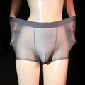Ultra-thin transparent men's ice silk boxer shorts in light grey on a size chart.