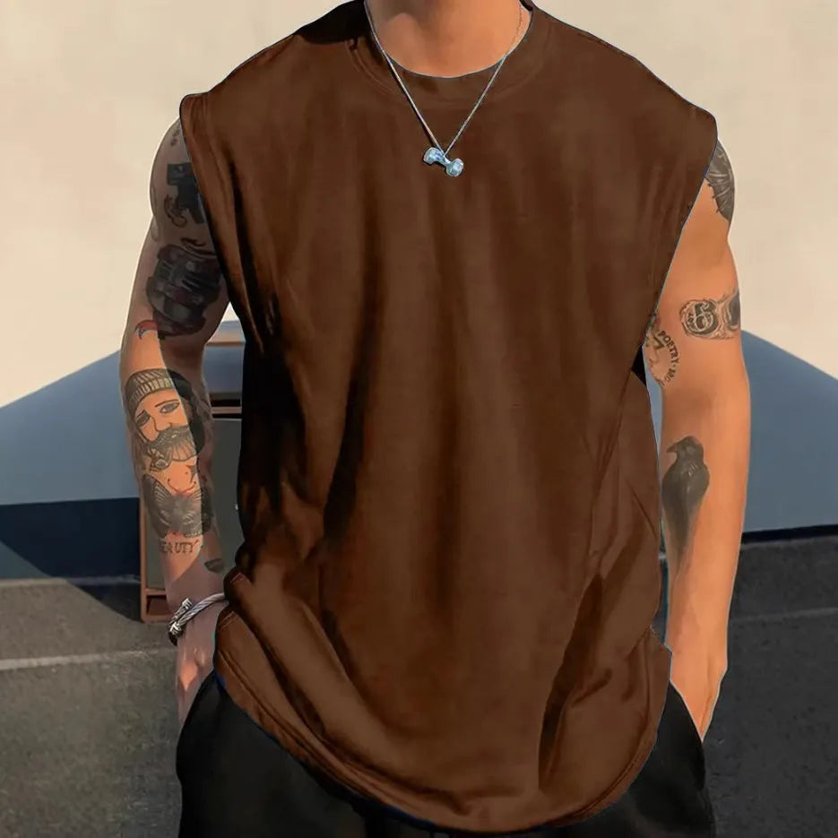 Men's solid colour loose sleeveless cotton tank top on a hanger, shown in apricot colour.