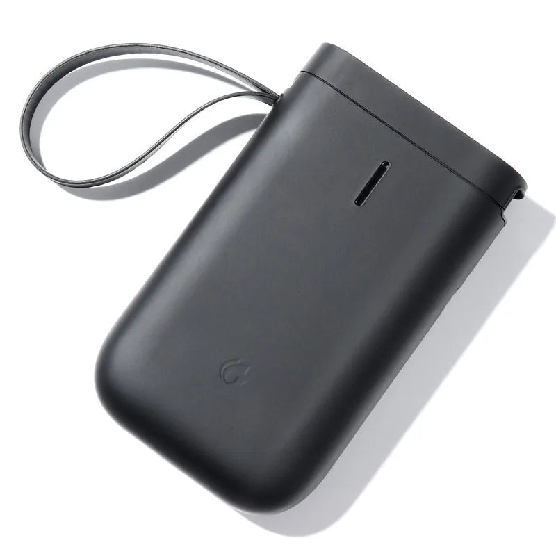 D11 Bluetooth thermal label printer in chosen colour next to smartphone showing label design app.
