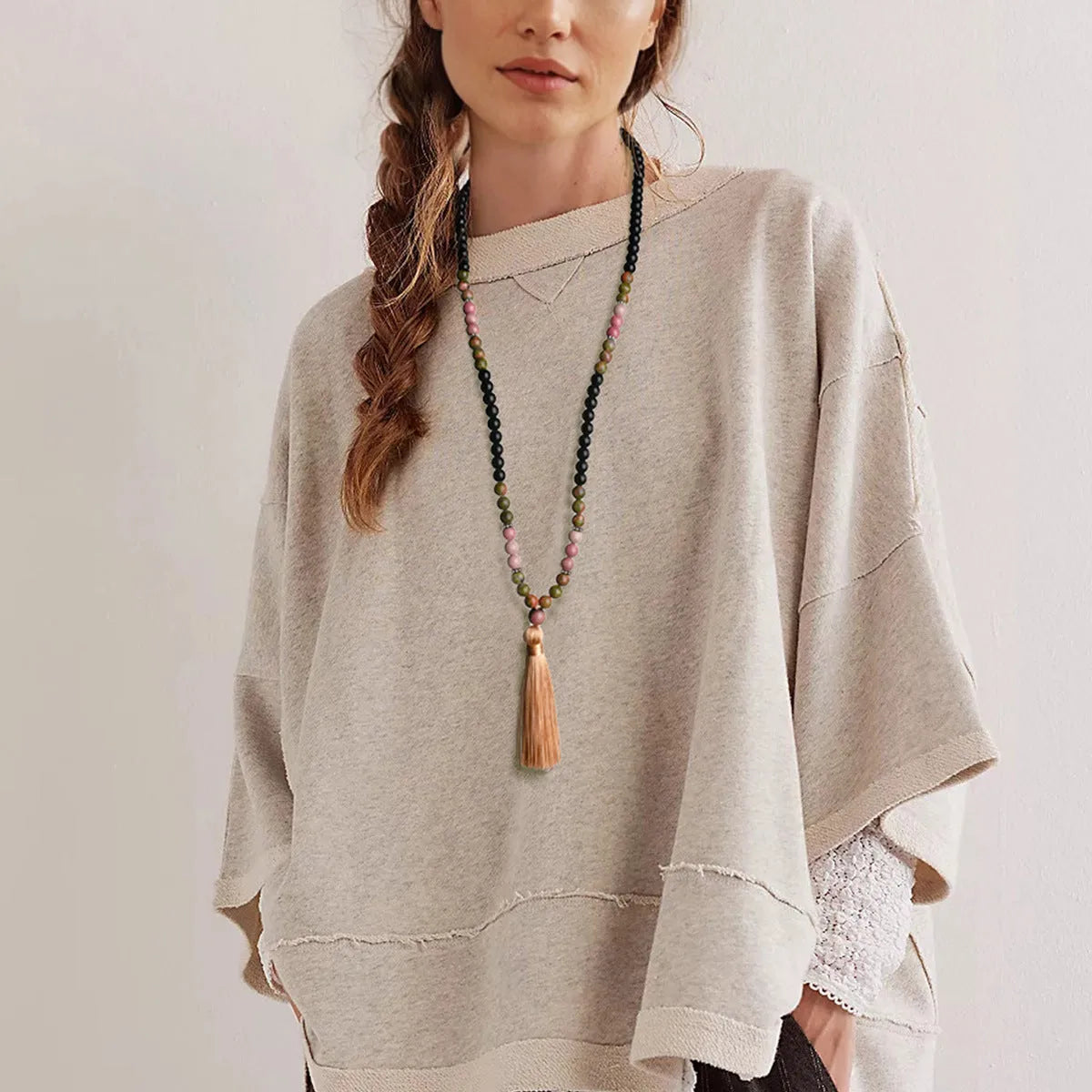 Long 108 natural stone bead necklace with mixed gemstone tassel pendant in bohemian style.
