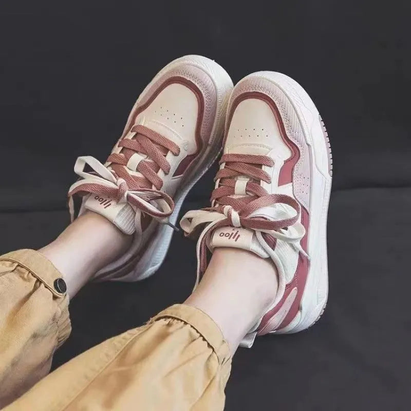 Women's pink and white low-top rubber sneakers with height increasing soles