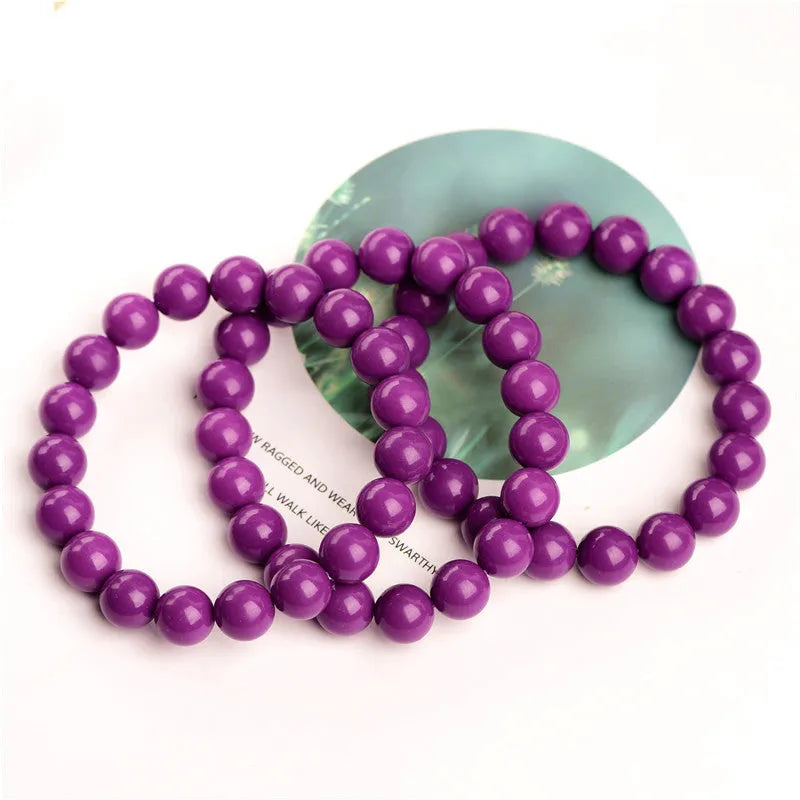 Jiuya polished crystal bracelet in purple mica colour, showing single strand of round beads.